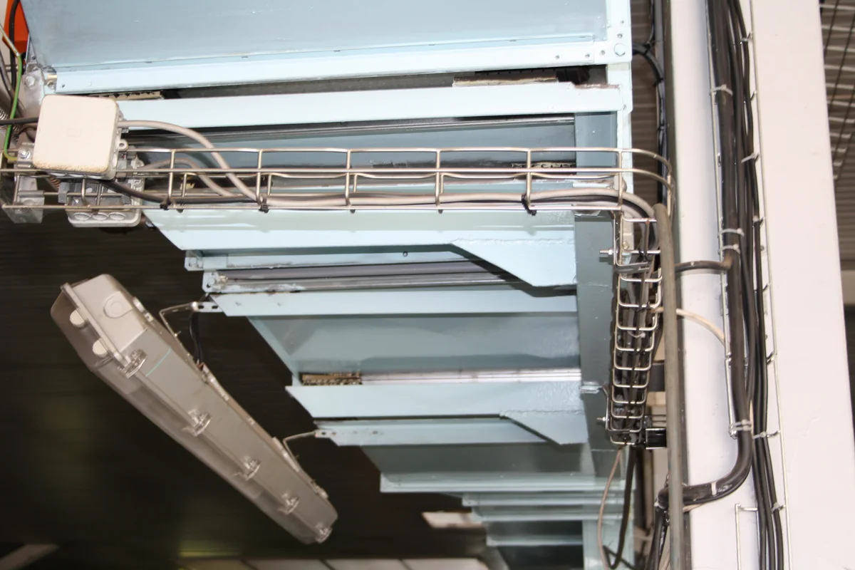 Electrical cable containment within a building services installation