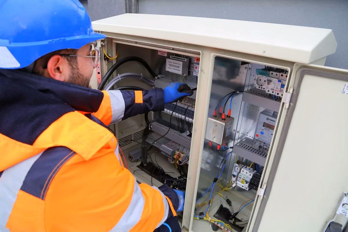 Electrical professional wearing protective workwear and safety equipment