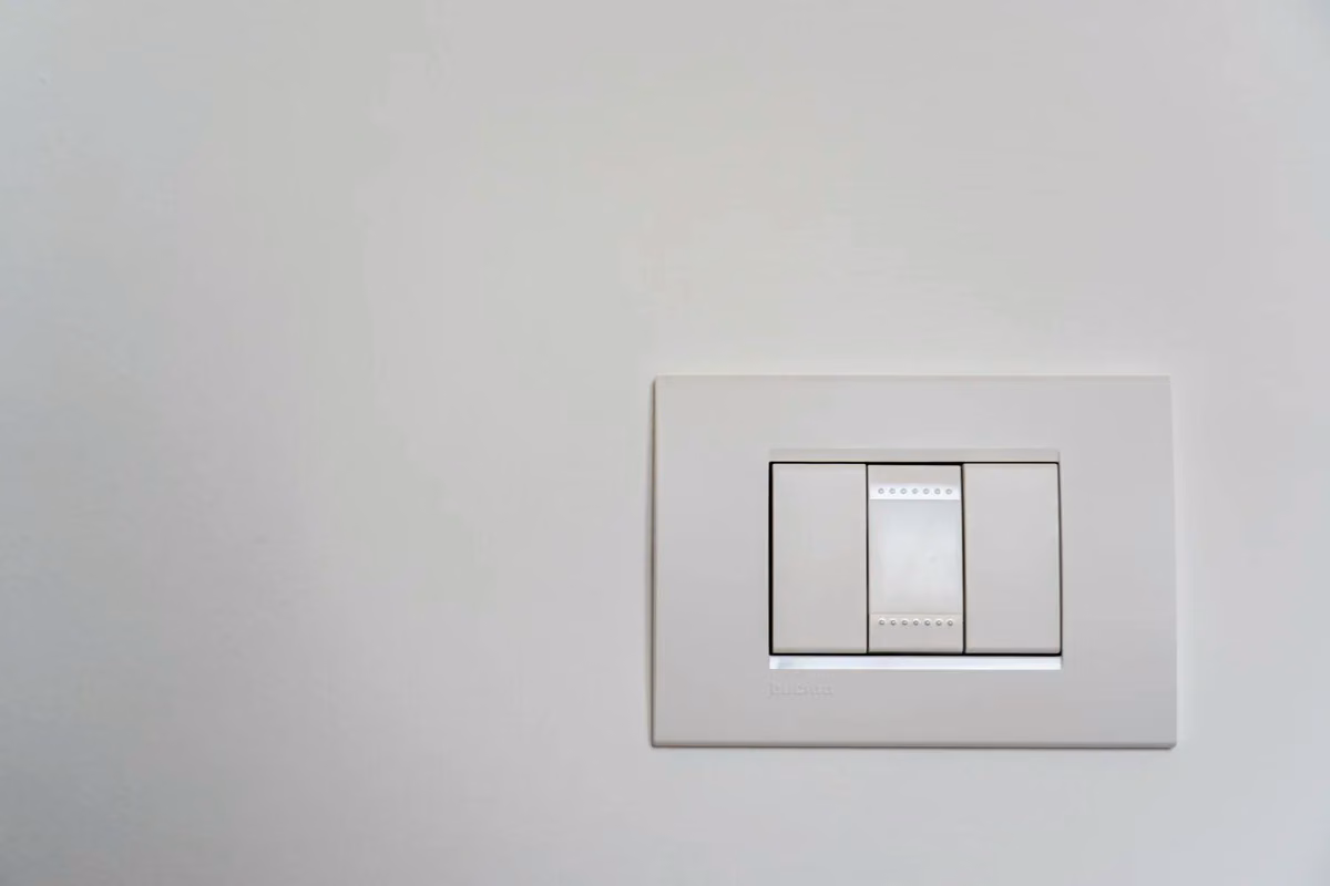 Modern white rocker switch on an interior wall